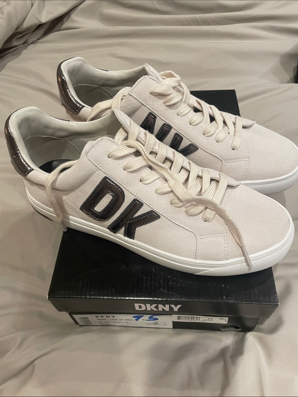 DKNY Women’s Cream Sneakers with Black DK Logo and Metallic Heel